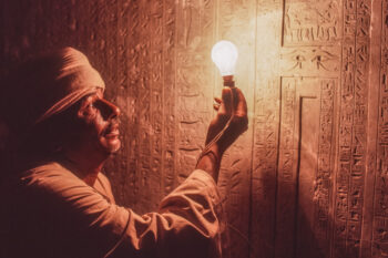 A guide illuminates hieroglyphics in the tomb of the Great Steward of Asus, Senenmut, who was a architect who led the construction of the temple of Queen Hatshepsut in Valley of Kings in Luxor, Egypt.