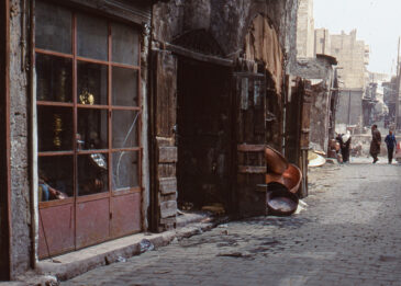 The Copper Souk in Aleppo, known locally as Souk al-Nahhasin, was built in 1539 and is situated within the historic Al-Madina Souq in the heart of Aleppo's Old City. This souk has been a center for copper craftsmanship for centuries, with artisans producing and selling intricately designed copperware. The souk's narrow, covered alleys are lined with shops displaying a variety of copper items, from traditional cookware to decorative pieces.