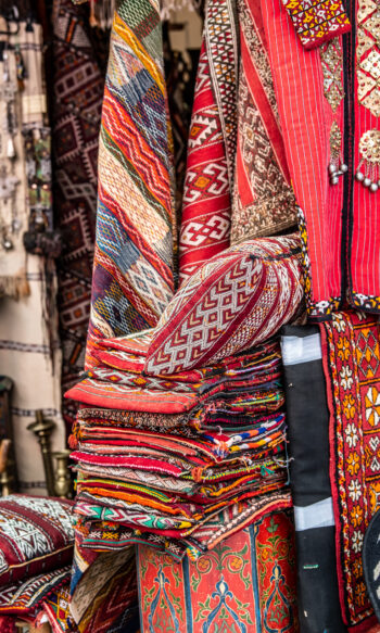 Carpet vendor on street of medina in Marrakesh, Morocco