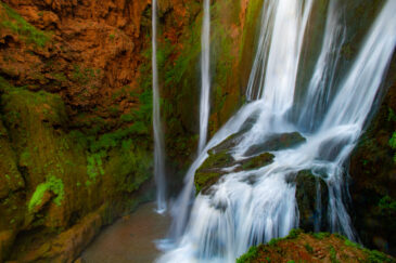 Ouzoud Falls is the collective name for several tall waterfalls that empty into the El-Abid River gorge. This popular tourism destination is located near the Moyen Atlas village of Tanaghmeilt, in the province of Azilal, 150 km northeast of Marrakech, Morocco.