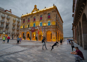 City Hall on Plaza Mayor at night in Guijon, Asturias, Spain