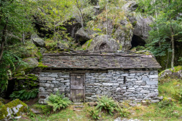 Traditional stone hut on Calnegia River trail near hamlet of Foroglio in Ticino, Switzerland