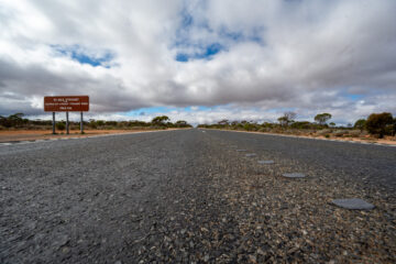 "90 Mile Straight" on Eyre Highway between Balladoniaand Caiguna on Nullarbor Plain of Western Australia. The longest straight stretch of road in Australia and one of the longest in the world. The road stretches for 146.6 kilometres.