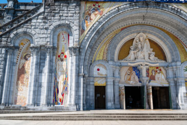 Lourdes is a town in southwestern France, in the foothills of the Pyrenees mountains. It’s known for the Sanctuaires Notre-Dame de Lourdes, or the Domain, a major Catholic pilgrimage site. Each year, millions visit the Grotto of Massabielle (Grotto of the Apparitions) where, in 1858, the Virgin Mary is said to have appeared to a local woman. In the grotto, pilgrims can drink or bathe in water flowing from a spring.