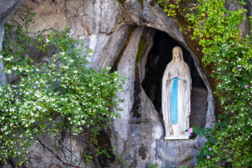 Lourdes is a town in southwestern France, in the foothills of the Pyrenees mountains. It’s known for the Sanctuaires Notre-Dame de Lourdes, or the Domain, a major Catholic pilgrimage site. Each year, millions visit the Grotto of Massabielle (Grotto of the Apparitions) where, in 1858, the Virgin Mary is said to have appeared to a local woman. In the grotto, pilgrims can drink or bathe in water flowing from a spring.
