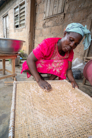 Demonstration of making couscous using sorghum by Emefa Ahatefou (blue dress) and Adjo AKANA (pink dress) of Atti-apédokoè. Improving Agricultural Resilience to Salinity through Development and Promotion of Pro-poor Technologies (RESADE). Visit to Togo, 23-25 August 2023. Photos: MIchael Major for ICBA