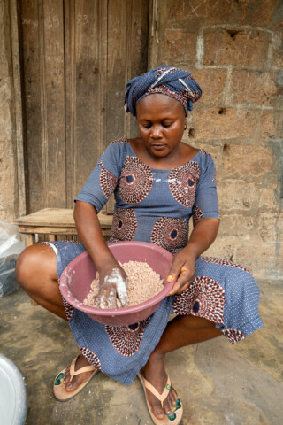 Demonstration of making couscous using sorghum by Emefa Ahatefou (blue dress) and Adjo AKANA (pink dress) of Atti-apédokoè. Improving Agricultural Resilience to Salinity through Development and Promotion of Pro-poor Technologies (RESADE). Visit to Togo, 23-25 August 2023. Photos: MIchael Major for ICBA