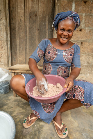 Demonstration of making couscous using sorghum by Emefa Ahatefou (blue dress) and Adjo AKANA (pink dress) of Atti-apédokoè. Improving Agricultural Resilience to Salinity through Development and Promotion of Pro-poor Technologies (RESADE). Visit to Togo, 23-25 August 2023. Photos: MIchael Major for ICBA