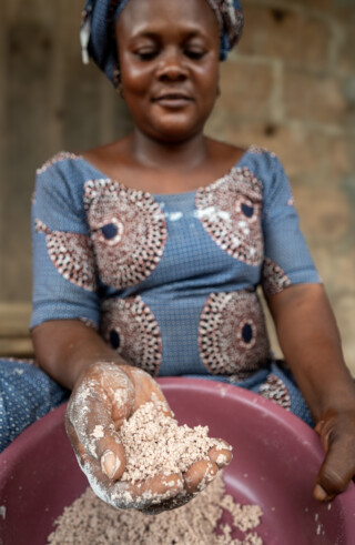 Demonstration of making couscous using sorghum by Emefa Ahatefou (blue dress) and Adjo AKANA (pink dress) of Atti-apédokoè. Improving Agricultural Resilience to Salinity through Development and Promotion of Pro-poor Technologies (RESADE). Visit to Togo, 23-25 August 2023. Photos: MIchael Major for ICBA