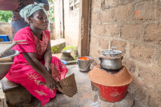 Demonstration of making couscous using sorghum by Emefa Ahatefou (blue dress) and Adjo AKANA (pink dress) of Atti-apédokoè. Improving Agricultural Resilience to Salinity through Development and Promotion of Pro-poor Technologies (RESADE). Visit to Togo, 23-25 August 2023. Photos: MIchael Major for ICBA