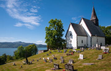 Byneset, Trøndelag, Norway - 15 July 2018: Byneset Church is a medieval church in the Byneset area of the city of Trondheim. It was consecrated in 1180 and renovated in 1811