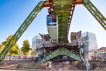 Wuppertal, Nordrhein-Westfalen / Germany - August 21, 2020:  The Wuppertaler Schwebebahn, an electric elevated railway with hanging cars, follows the River Wupper. Designed by Eugen Langen it first opened in 1901.