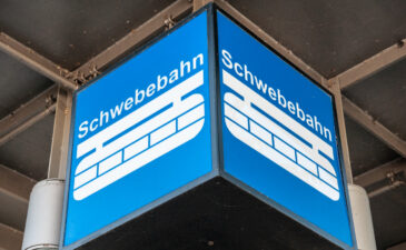 Wuppertal, Nordrhein-Westfalen / Germany - August 21, 2020:  The Wuppertaler Schwebebahn, an electric elevated railway with hanging cars, follows the River Wupper. Designed by Eugen Langen it first opened in 1901.