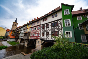 The Krämerbrücke (Merchants' bridge) is a medieval arch bridge in Erfurt, Thuringia in central Germany, which is lined with half timbered shops and houses on both sides of a cobblestone street. It is one of the few remaining bridges in the world that have inhabited buildings. It has been continuously inhabited for over 500 years.