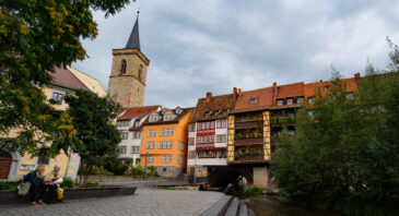 The Krämerbrücke (Merchants' bridge) is a medieval arch bridge in Erfurt, Thuringia in central Germany, which is lined with half timbered shops and houses on both sides of a cobblestone street. It is one of the few remaining bridges in the world that have inhabited buildings. It has been continuously inhabited for over 500 years.