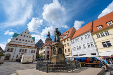 Statute of Martin Luther in Market Square of Lutherstadt Eisleben in Saxony-Anhalt, Germany. Martin Luther was born in Eisleben in 1483 and died here in 1546.