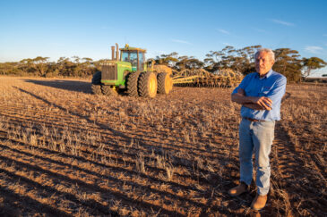 Farmer dry sowing wheat with GPS-guided direct seeder in Kimba, South Australia under dry conditions