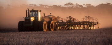 Farmer dry sowing wheat with GPS-guided direct seeder in Kimba, South Australia under dry conditions