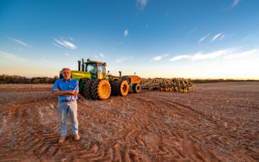 Farmer dry sowing wheat with GPS-guided direct seeder in Kimba, South Australia under dry conditions
