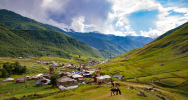 Grazing horse in hills outside of Ushguli, Georgia. At 2100 masl Ushguli is one of the highest continuously inhabited settlements in Europe