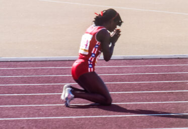 Valerie Brisco-Hooks gives thanks after winning the 400 m - one of three golds she won in the track in 1984.
