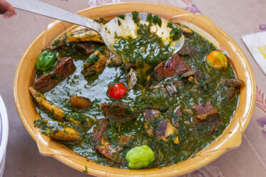 Ninnouwi (jute mallow soup) and telibo (dried yam dough) served in a restaurant in Natitingou, Benin.
Visit by Scott Christiansen and Michael Major, consultants to Crop Trust, to document BOLDER value chain research on fonio and jute mallow in Benin. 11-17 October 2025.
Photo: Michael Major for Crop Trust