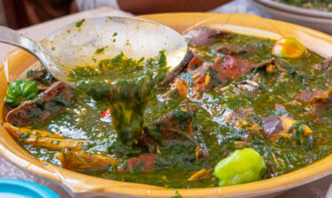 Ninnouwi (jute mallow soup) and telibo (dried yam dough) served in a restaurant in Natitingou, Benin.
Visit by Scott Christiansen and Michael Major, consultants to Crop Trust, to document BOLDER value chain research on fonio and jute mallow in Benin. 11-17 October 2025.
Photo: Michael Major for Crop Trust