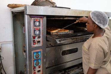 Esther Yoham Majija uses traditional African vegetables in products she makes at her bakery, the Fortlene Bakery, in Babati, Tanzania. A team from BOLDER and World Vegetable Center visited her to see products made with Bambara groundnut.
Photo: Michael Major for Crop Trust
