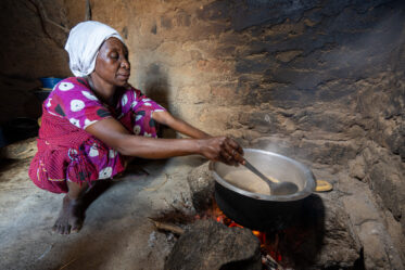 Rose Saimon Kimati, with the help of her two daughters, cooks Bambara groundnut in Unyamikumbi, Singida, Tanzania.
Photo: Michael Major for Crop Trust