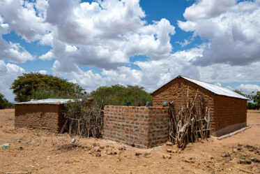 Rose Saimon Kimati, with the help of her two daughters, cooks Bambara groundnut in Unyamikumbi, Singida, Tanzania.
Photo: Michael Major for Crop Trust