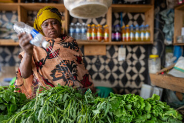Street vendor in Singida, Tanzania selling sweetpotato leaves.
Photo: Michael Major for Crop Trust