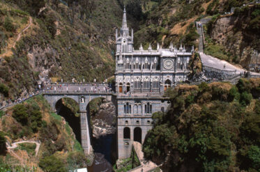 Santuario de Nuestra Senora de Las Lajas is located seven kilometres from Ipiales in southwest Colombia. Built between 1916 and 1948 in a valley on the Guaitara River. Attracts pilgrims from all over Colombia and abroad - one of most visited religious sanctuaries in the Americas. GIS = 0°47'30.94"N and 77°36'17.85"W