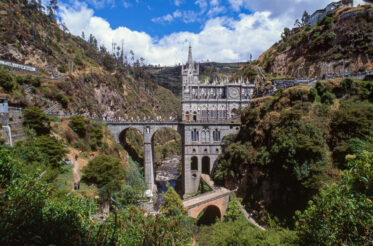 Santuario de Nuestra Senora de Las Lajas is located seven kilometres from Ipiales in southwest Colombia. Built between 1916 and 1948 in a valley on the Guaitara River. Attracts pilgrims from all over Colombia and abroad - one of most visited religious sanctuaries in the Americas. GIS = 0°47'30.94"N and 77°36'17.85"W