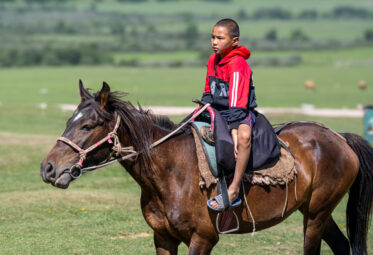Boy on horse in Kyrgyzstan