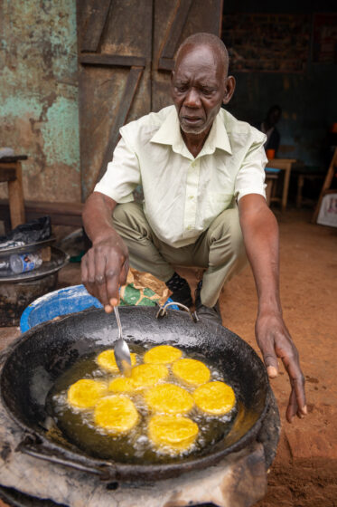 Tom Zijja, a pumpkin processor and aggregator in Balawoli, Kamuli District, Uganda, represents the value-addition end of a growing pumpkin value chain. Sourcing from local farmers, Tom transforms an often-overlooked crop into juice, fritters, flour, puree, and snacks — wasting nothing. Pumpkin is increasingly recognised as a high-potential opportunity crop in Uganda, nutritious, storable, and familiar, but still waiting for the support systems that could take entrepreneurs like Tom from a charcoal stove to something much bigger.
Photo: Michael Major for Crop Trust