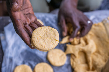 Tom Zijja, a pumpkin processor and aggregator in Balawoli, Kamuli District, Uganda, represents the value-addition end of a growing pumpkin value chain. Sourcing from local farmers, Tom transforms an often-overlooked crop into juice, fritters, flour, puree, and snacks — wasting nothing. Pumpkin is increasingly recognised as a high-potential opportunity crop in Uganda, nutritious, storable, and familiar, but still waiting for the support systems that could take entrepreneurs like Tom from a charcoal stove to something much bigger.
Photo: Michael Major for Crop Trust