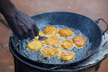 Tom Zijja, a pumpkin processor and aggregator in Balawoli, Kamuli District, Uganda, represents the value-addition end of a growing pumpkin value chain. Sourcing from local farmers, Tom transforms an often-overlooked crop into juice, fritters, flour, puree, and snacks — wasting nothing. Pumpkin is increasingly recognised as a high-potential opportunity crop in Uganda, nutritious, storable, and familiar, but still waiting for the support systems that could take entrepreneurs like Tom from a charcoal stove to something much bigger.
Photo: Michael Major for Crop Trust
