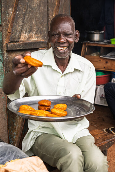 Tom Zijja, a pumpkin processor and aggregator in Balawoli, Kamuli District, Uganda, represents the value-addition end of a growing pumpkin value chain. Sourcing from local farmers, Tom transforms an often-overlooked crop into juice, fritters, flour, puree, and snacks — wasting nothing. Pumpkin is increasingly recognised as a high-potential opportunity crop in Uganda, nutritious, storable, and familiar, but still waiting for the support systems that could take entrepreneurs like Tom from a charcoal stove to something much bigger.
Photo: Michael Major for Crop Trust
