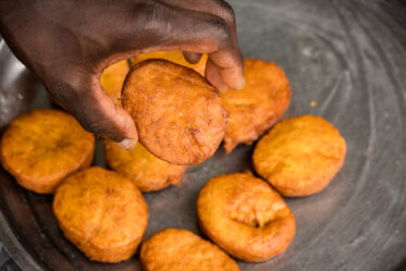 Tom Zijja, a pumpkin processor and aggregator in Balawoli, Kamuli District, Uganda, represents the value-addition end of a growing pumpkin value chain. Sourcing from local farmers, Tom transforms an often-overlooked crop into juice, fritters, flour, puree, and snacks — wasting nothing. Pumpkin is increasingly recognised as a high-potential opportunity crop in Uganda, nutritious, storable, and familiar, but still waiting for the support systems that could take entrepreneurs like Tom from a charcoal stove to something much bigger.
Photo: Michael Major for Crop Trust