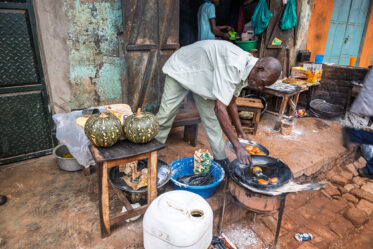 Tom Zijja, a pumpkin processor and aggregator in Balawoli, Kamuli District, Uganda, represents the value-addition end of a growing pumpkin value chain. Sourcing from local farmers, Tom transforms an often-overlooked crop into juice, fritters, flour, puree, and snacks — wasting nothing. Pumpkin is increasingly recognised as a high-potential opportunity crop in Uganda, nutritious, storable, and familiar, but still waiting for the support systems that could take entrepreneurs like Tom from a charcoal stove to something much bigger.
Photo: Michael Major for Crop Trust