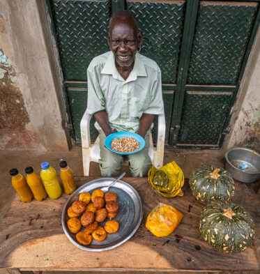 Tom Zijja, a pumpkin processor and aggregator in Balawoli, Kamuli District, Uganda, represents the value-addition end of a growing pumpkin value chain. Sourcing from local farmers, Tom transforms an often-overlooked crop into juice, fritters, flour, puree, and snacks — wasting nothing. Pumpkin is increasingly recognised as a high-potential opportunity crop in Uganda, nutritious, storable, and familiar, but still waiting for the support systems that could take entrepreneurs like Tom from a charcoal stove to something much bigger.
Photo: Michael Major for Crop Trust