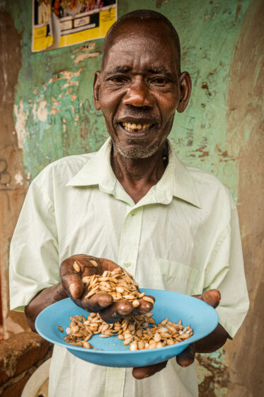 Tom Zijja, a pumpkin processor and aggregator in Balawoli, Kamuli District, Uganda, represents the value-addition end of a growing pumpkin value chain. Sourcing from local farmers, Tom transforms an often-overlooked crop into juice, fritters, flour, puree, and snacks — wasting nothing. Pumpkin is increasingly recognised as a high-potential opportunity crop in Uganda, nutritious, storable, and familiar, but still waiting for the support systems that could take entrepreneurs like Tom from a charcoal stove to something much bigger.
Photo: Michael Major for Crop Trust