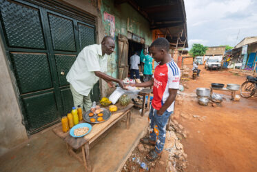 Tom Zijja, a pumpkin processor and aggregator in Balawoli, Kamuli District, Uganda, represents the value-addition end of a growing pumpkin value chain. Sourcing from local farmers, Tom transforms an often-overlooked crop into juice, fritters, flour, puree, and snacks — wasting nothing. Pumpkin is increasingly recognised as a high-potential opportunity crop in Uganda, nutritious, storable, and familiar, but still waiting for the support systems that could take entrepreneurs like Tom from a charcoal stove to something much bigger.
Photo: Michael Major for Crop Trust